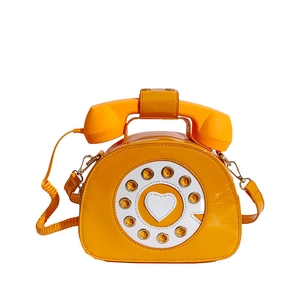 Borsa a tracolla retrò a forma di telefono arancione lucido con manico e tastiera a disco