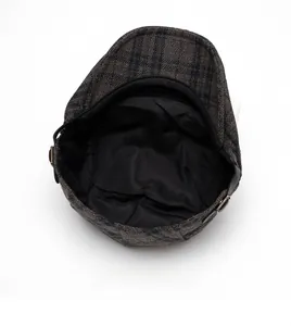 Detail of wool beret inner lining and adjustable metal side buckle for head size