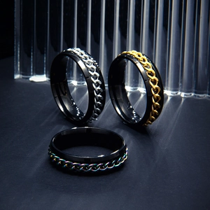 Detailed macro view of 6mm wide stainless steel spinner rings with colorful chain inlays