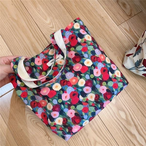 Close-up of vintage floral cotton handbag featuring high-quality simple wish woven label
