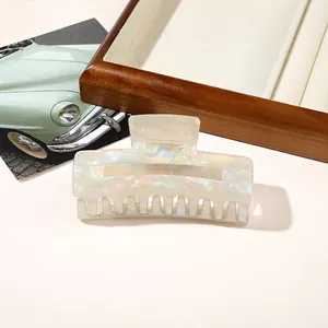 Iridescent rectangular claw clip with mother-of-pearl finish for elegant hair styling