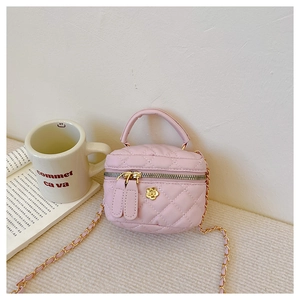 Detail of pink quilted PU leather mini bag with gold flower zipper and chain strap