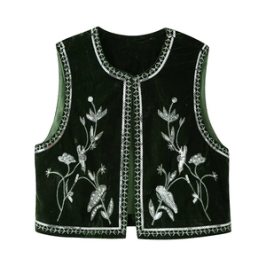 Dark green velvet waistcoat with silver floral embroidery and sequin trim on white background