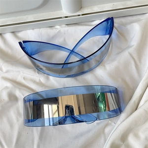 Detail of blue Y2K cat-eye sunglasses with silver mirror lenses and futuristic frame