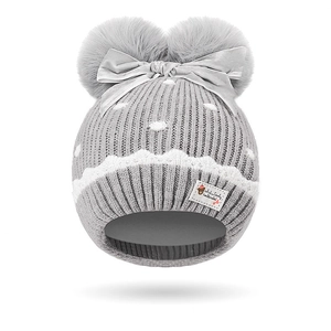 Grey knit winter hat for toddler girls with double pom poms and cute bow accent