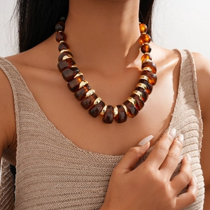 Retro acrylic chunky bead necklace in amber and gold with adjustable metal ring details