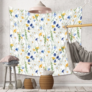Detail of bohemian floral tapestry with watercolor flowers in a cozy home setting