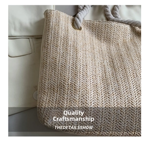 Detailed close-up of woven tote bag texture with soft rope handles and metal eyelets