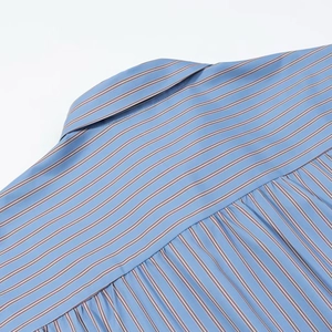 Detail of blue striped shirt neck with exquisite back pleats and fine fabric texture