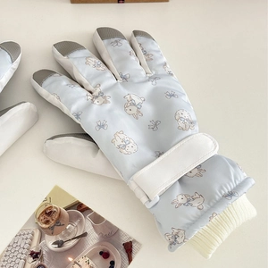 Light blue ski gloves with cute bunny print and adjustable wrist straps for winter warmth