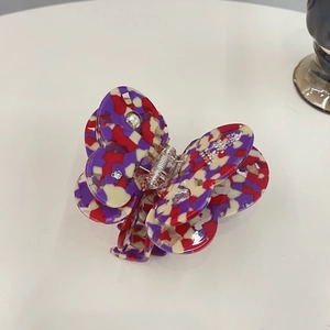 Elegant butterfly hair claw clip with colorful terrazzo pattern and rhinestone accents
