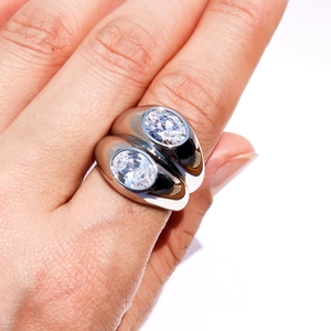 Modern double-layer silver ring with large oval zircon crystals on white background