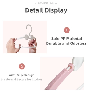 Close-up of non-slip PP material baby clothes hanger with heart bow design details