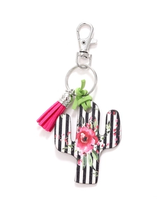 Detail of wooden cactus keychain with striped pattern, pink roses and tassel ornament