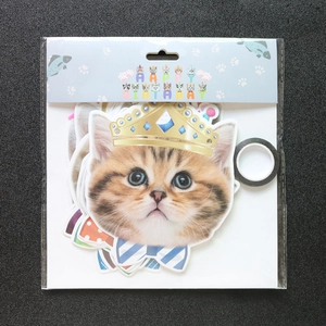 Detail of Happy Birthday banner featuring cat face cutouts for pet party decoration