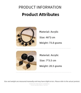 Detail view of bold black acrylic beaded necklace and heart earrings with size parameters