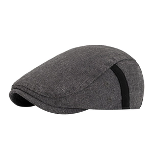 Classic dark grey vintage newsboy cap with textured knit fabric and side ribbon detail