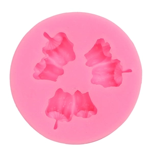 Pink silicone mold for fruit and flower shapes on a clean white background