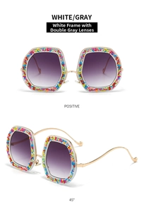 Cat eye sunglasses with colorful sugar crumb accents and white frames for parties