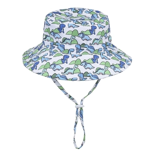 Detail of kids sun hat with blue dinosaur prints and white adjustable chin strap