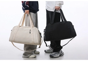 Large capacity travel duffle bags in beige and black shown with models for scale