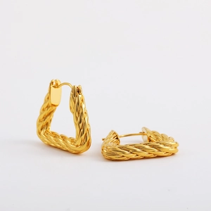 Detailed close-up of 18K gold-plated triangular earrings with twisted rope texture design