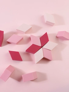 Macro detail of diamond-shaped makeup sponges in pink gradients for flawless application