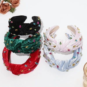 Detail of colorful velvet knotted headbands with sparkling rhinestones in five colors