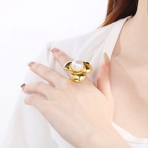 Macro shot of 18K gold plated flower petal ring with a large white pearl center