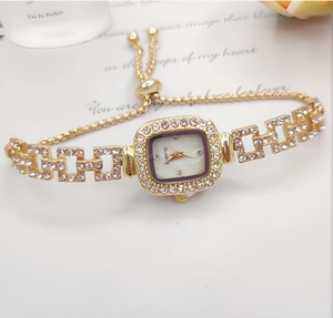 Detail of square dial women's watch with crystal-encrusted gold adjustable bracelet