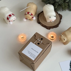 Polar bear candles in gift box with red scarf details for holiday home decoration