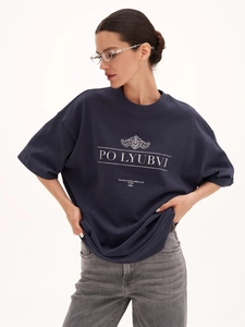 Detail of navy cotton T-shirt featuring artistic letter print and premium fabric texture