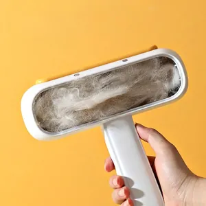 Ergonomic handheld pet hair remover with large collection chamber for cat and dog fur