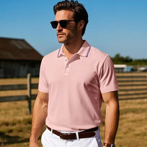 Men's pink cotton polo shirt with tricolor striped collar detail in a sunny outdoor setting