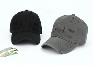 Detailed macro view of distressed striped baseball caps with frayed holes and washed fabric