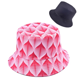 Detail showing the reversible design of the wide brim sun hat with leaf pattern print