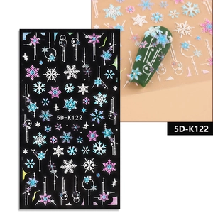 Detailed 5D embossed nail stickers featuring white snowflakes and geometric lines patterns