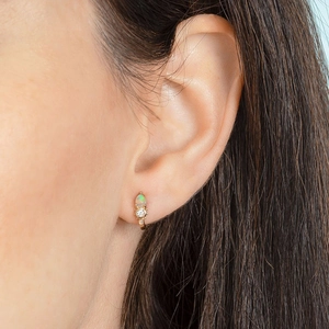 French style gold teardrop opal earrings with diamond accents on a model for a luxury look