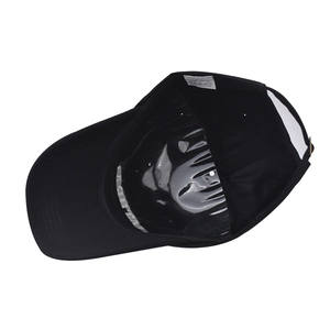 Detailed view of 100% cotton baseball cap interior with washing label and adjustable strap