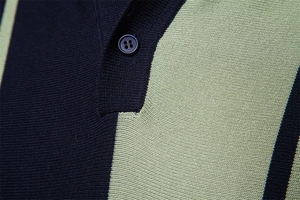 Detailed close-up of knit texture and button placket on a striped polo shirt