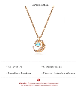 Macro detail of crescent moon pendant necklace with measurements and copper material info