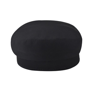 Detail view of a black baker boy hat with high-quality stitching and cotton fabric