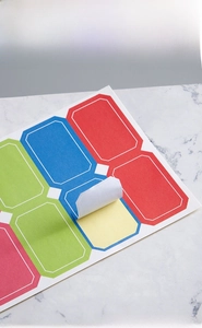 Detail of colorful self-adhesive label stickers set with laser-cut rounded corners