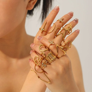 Chunky gold-plated stackable ring set with cross charms and rhinestones for women