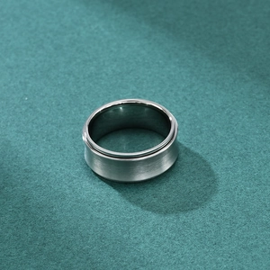 Men's spinning stress relief ring in brushed titanium steel with a polished inner band