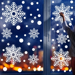 Close-up of white snowflake static window stickers for Christmas home glass decoration