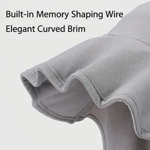 Light gray sun hat with flexible wide brim showing woven fabric texture and wavy design
