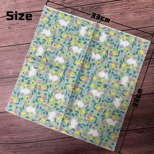 Floral paper napkins with rabbit pattern for parties, size 33x33cm on wooden background