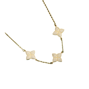 Elegant gold necklace featuring three sparkling four-leaf clover charms with inlaid zircon