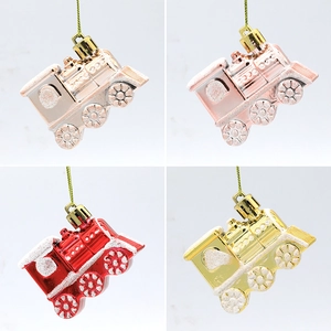 Set of four glittering Christmas train hanging ornaments in silver pink red and gold colors